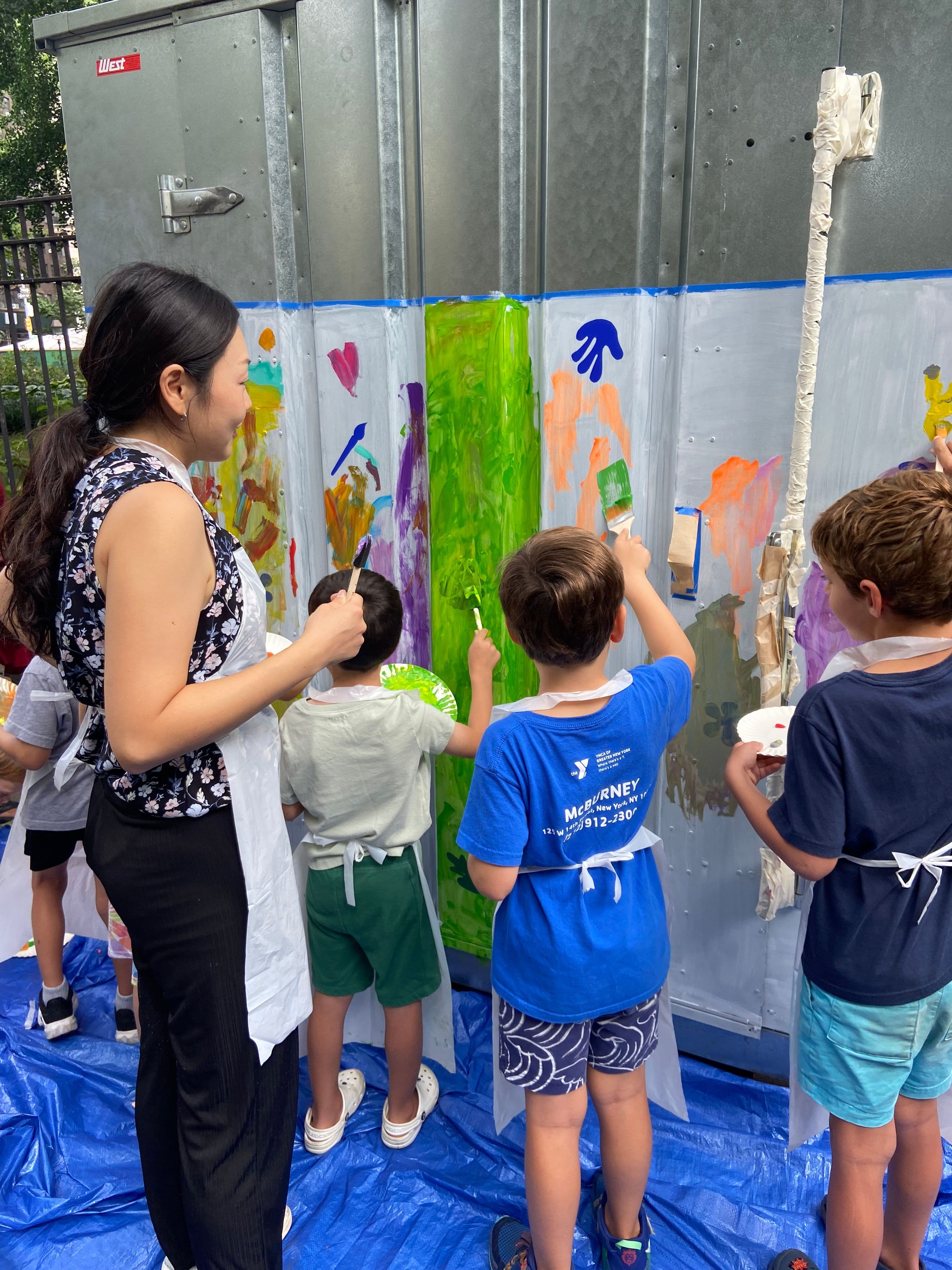 Kids make art in the park.