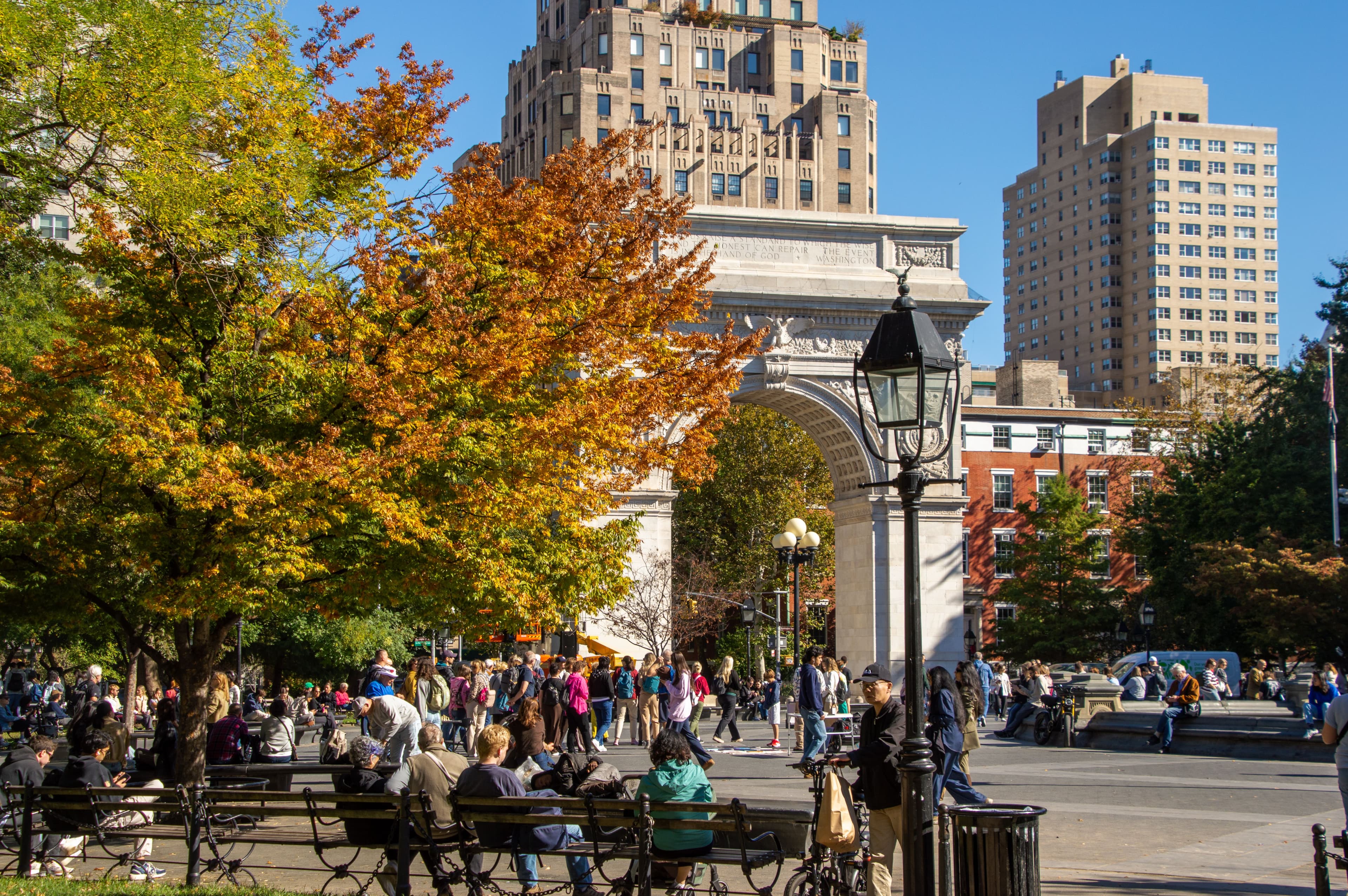 Fall foliage in front of the Washington Square Arch in Washington Square Park.