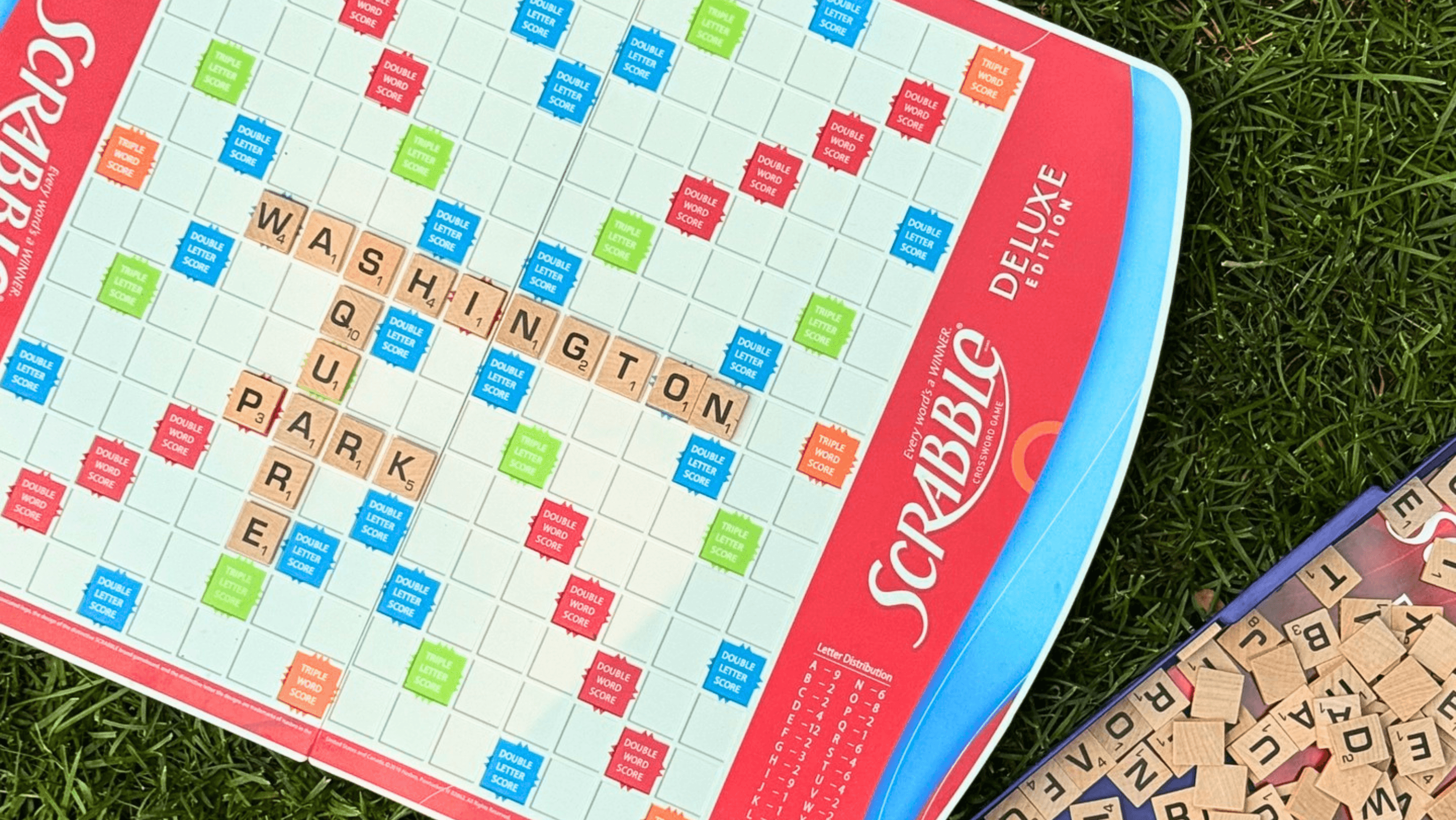 A Scrabble board that says 'Washington Square Park'