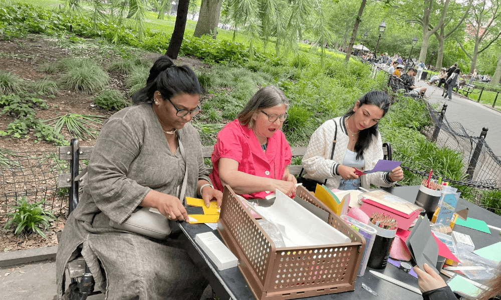 Women doing arts and crafts in the park