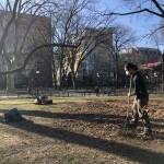 Gardener Tyson raking one of the eastern lawns