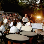 an orchestra performs at the Washington Square Music Festival