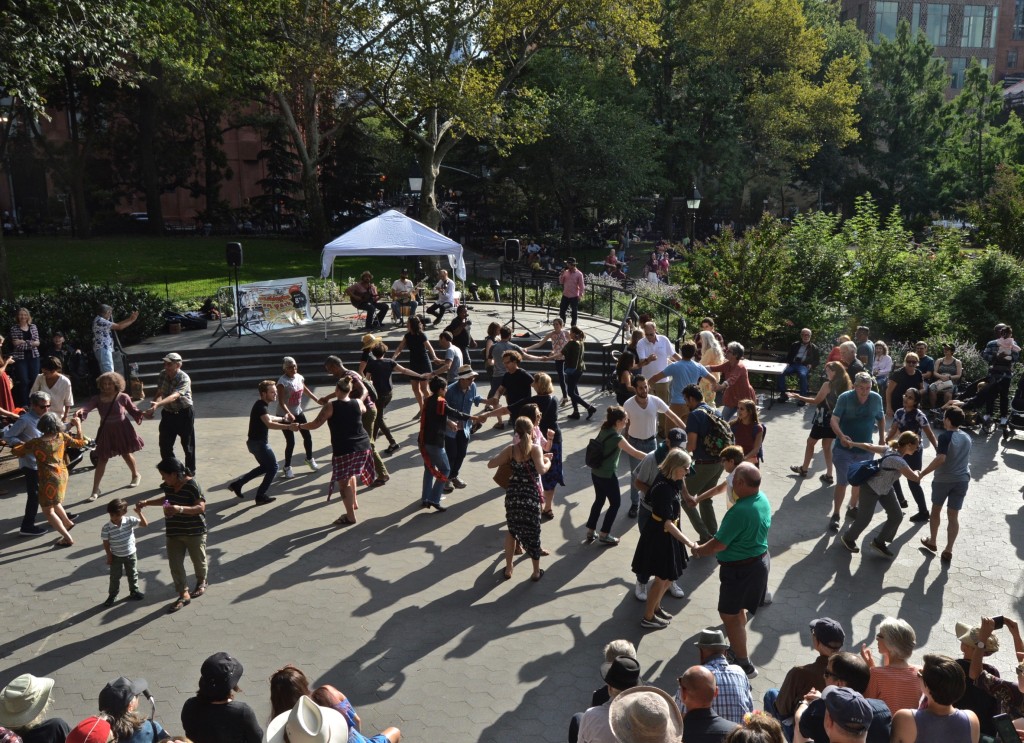 People dancing along to tunes from the Washington Square Music Festival