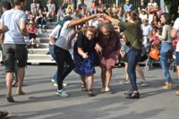 Folk Festival goers dancing to the music at the 2019 concert hosted by Community Arts Grantee the Washington Square Park Folk Festival.