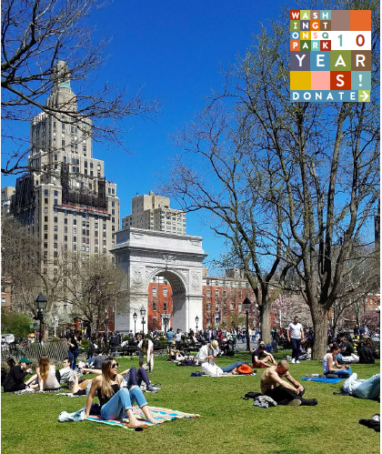 multiple groups of people sitting on grass in the park on a sunny day with the arch, trees, and skyscrapers in the background