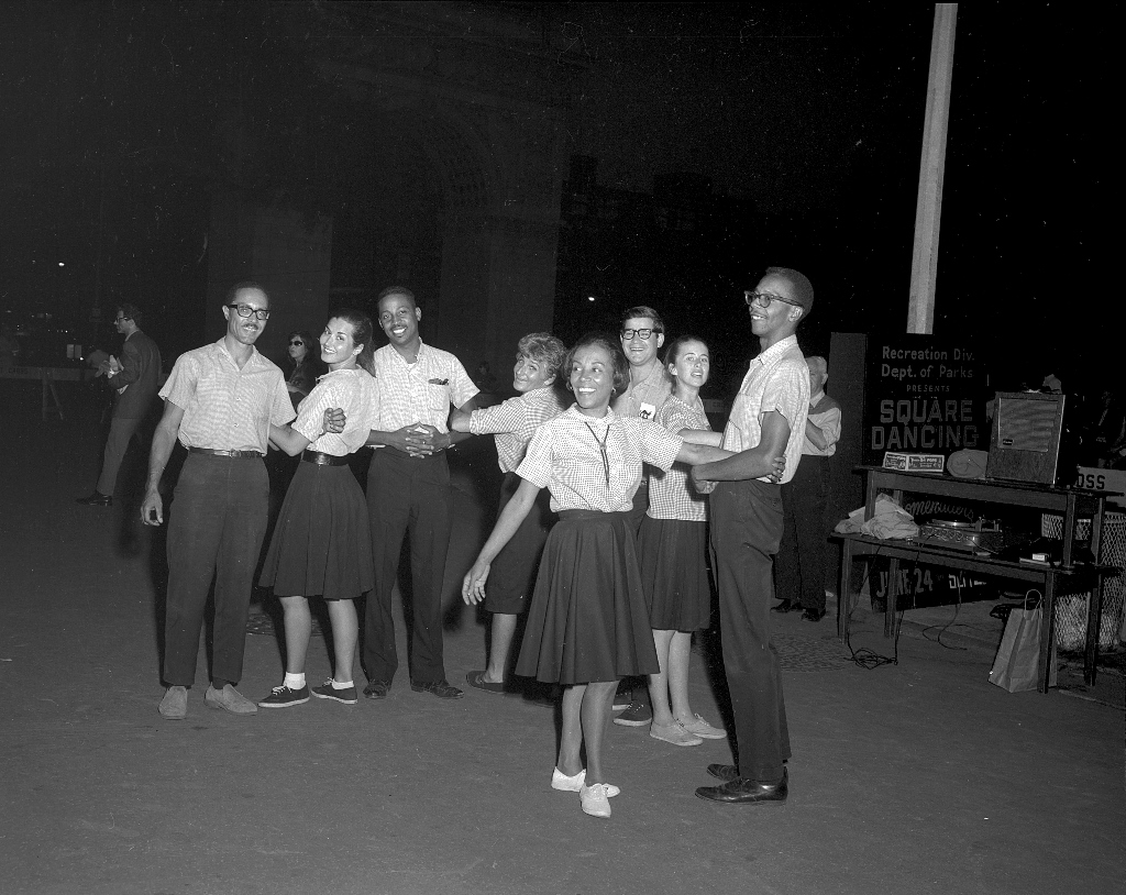 Young New Yorkers gather in the Park for a Square Dance evening sponsored by the "Recreation Division of the Department of Parks" in 1966