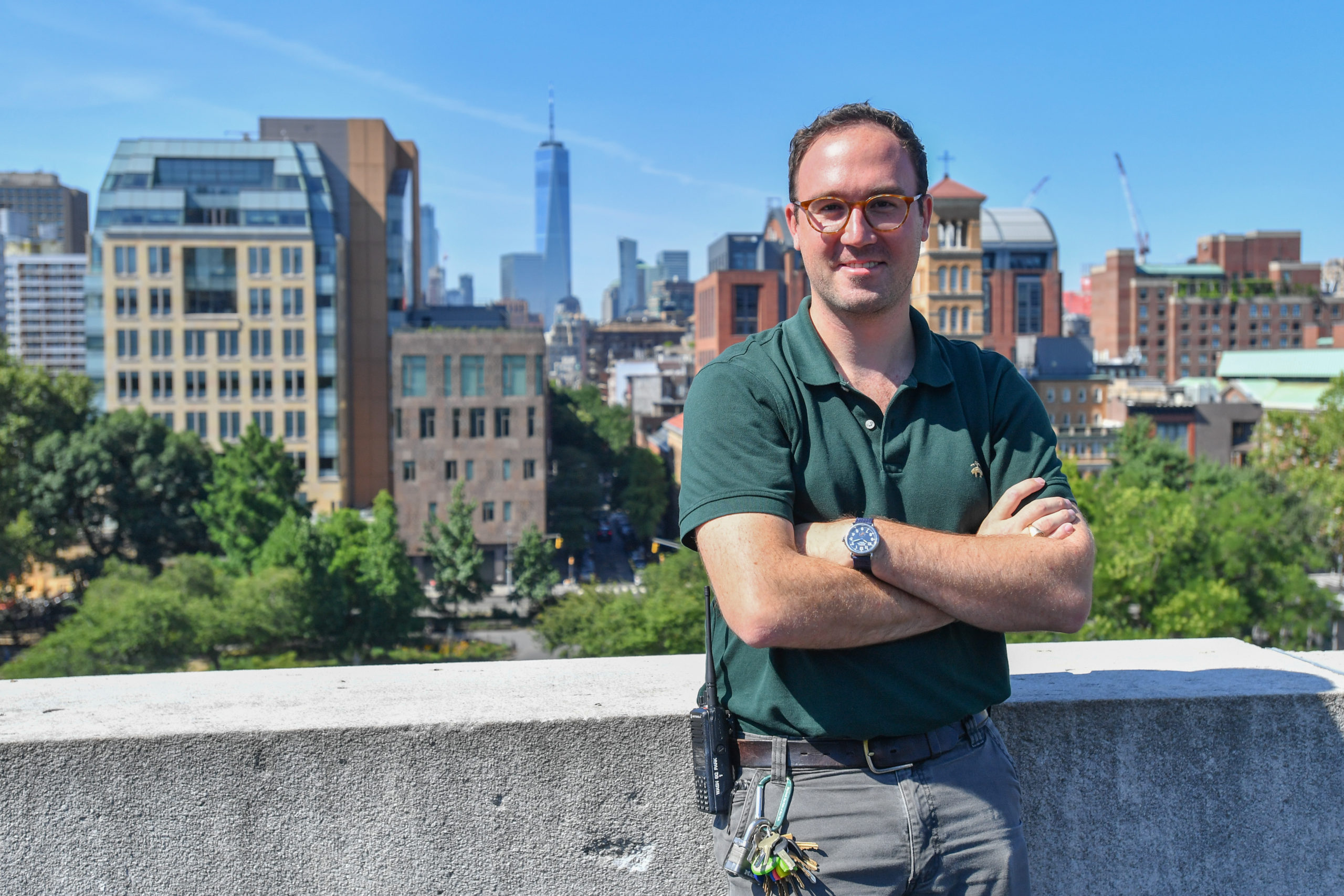 WSP deputy administrator Will Morrison smiles on the top of the Arch with the Park and skyline looking downtown behind him